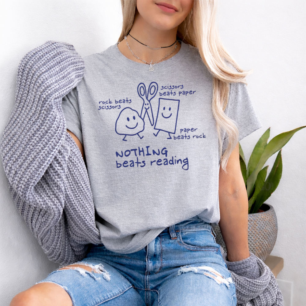 books over people shirt with 'Nothing Beats Reading' doodle 2